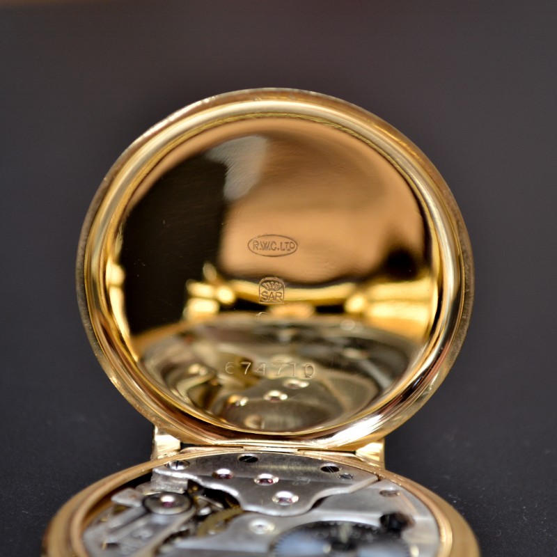 Rolex 1920s trench watch inner case back, stamped RWC Ltd and SAR hallmarks, gold-plated hinged dust cover open