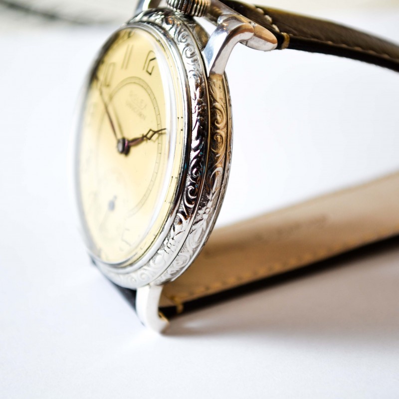 Rolex Unicorn 45mm case side profile showing art deco engraved bezel, crown and wire lug attachment detail, circa 1930s