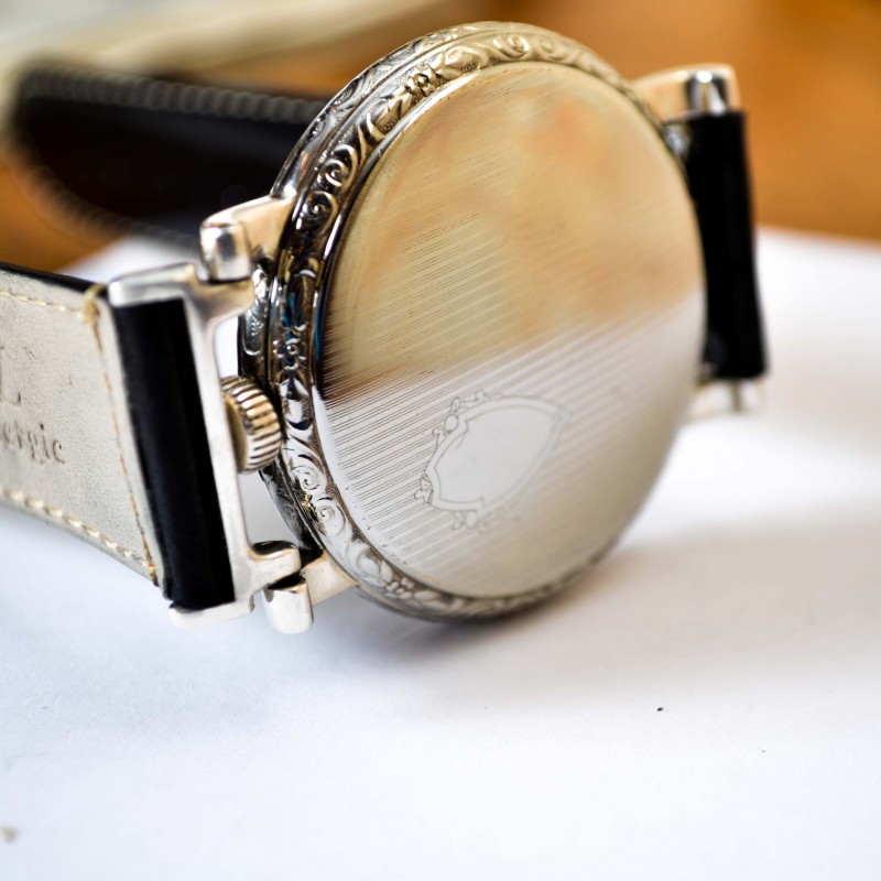 Rolex Unicorn 45mm case back view showing engine-turned guilloche decoration and monogram shield on screw-down back, circa 1930s