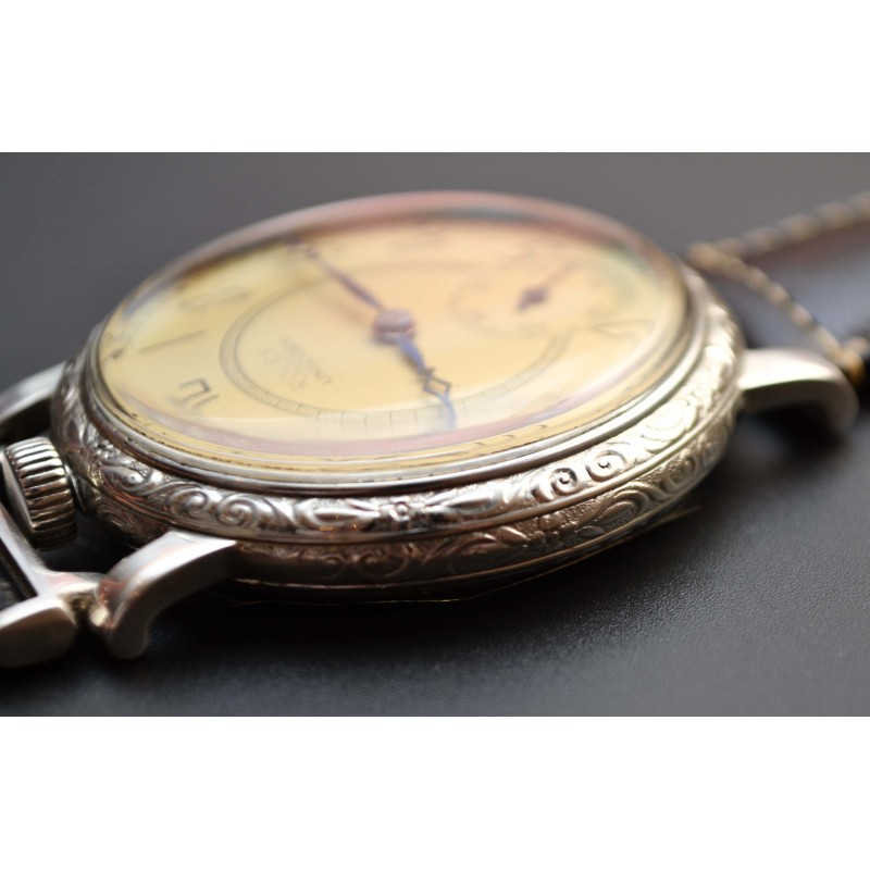 Rolex Unicorn 45mm low angle side profile showing engraved bezel detail, case thickness and crown on leather strap, circa 1930s