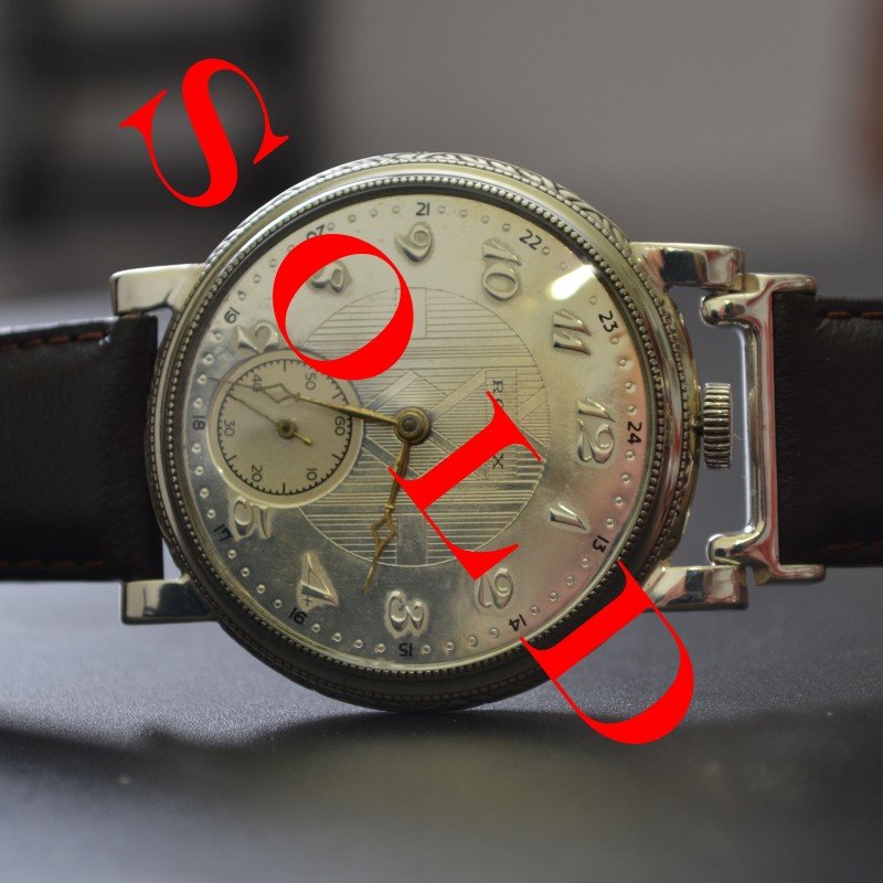 Rolex Unicorn 45mm watch, front view of guiloche dial with Arabic numerals, small seconds subdial, and Art Deco case with wire lugs, vintage 1930s era