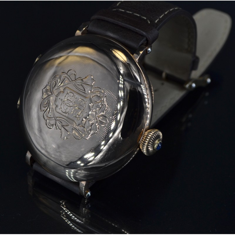 Audemars Piguet antique 14kt gold hunter case wristwatch, closed case back with engraved floral design and blue sapphire crown, early 1900s
