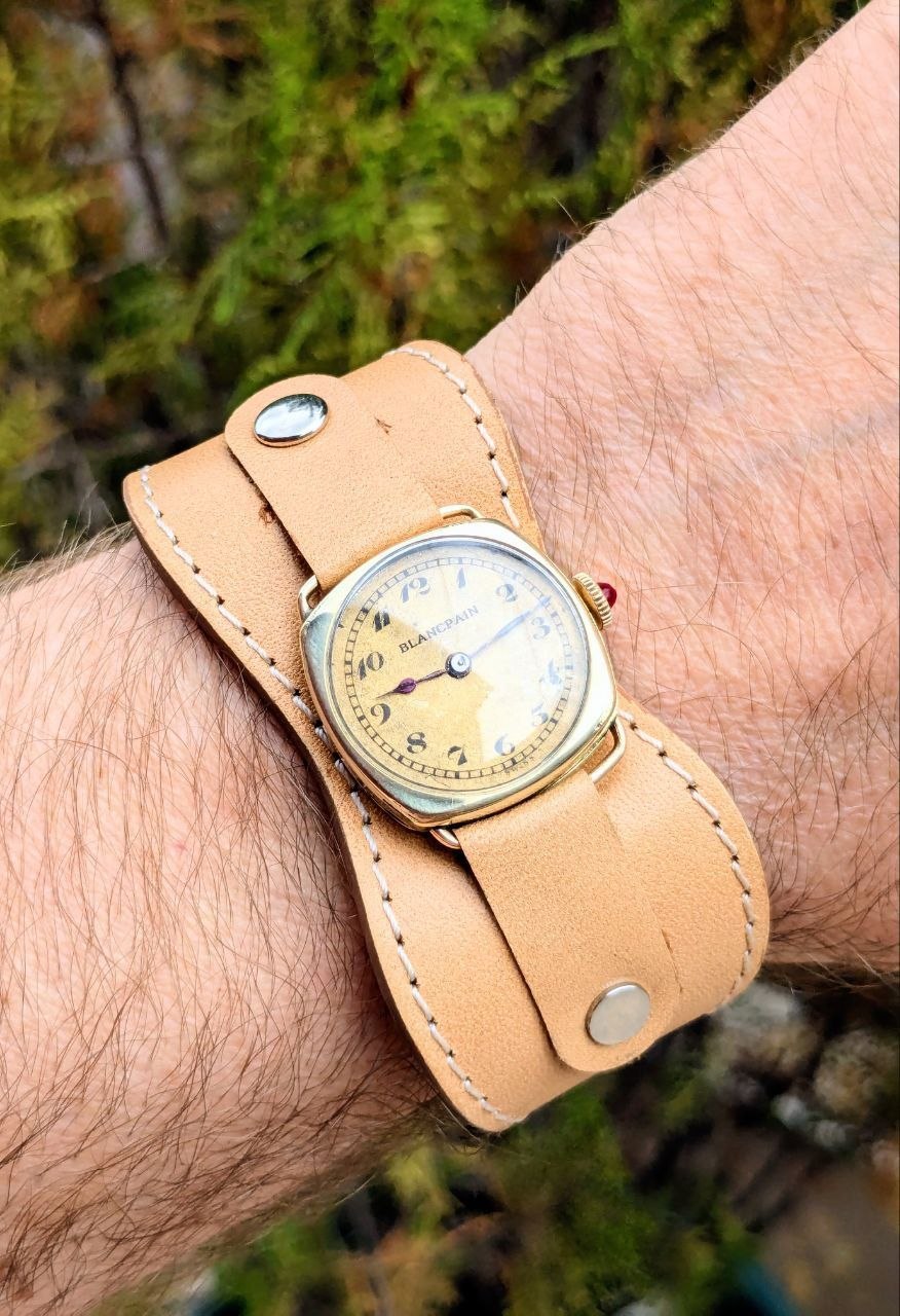 Original patinated gold guilloché dial of Blancpain trench watch with Arabic numerals and blued steel hands