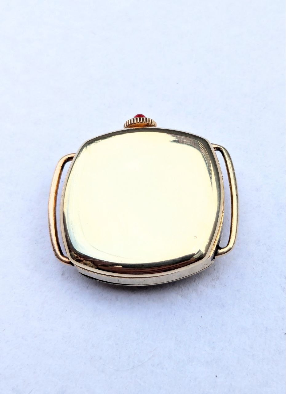 Side view of antique trench watch gold‑filled square cushion case, signed case number 19282647, no strap