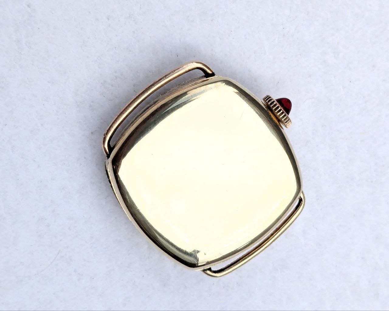 Blancpain‑LeCoultre trench watch case back with Hallmark stamp, gold‑plated finish, 24x24mm size