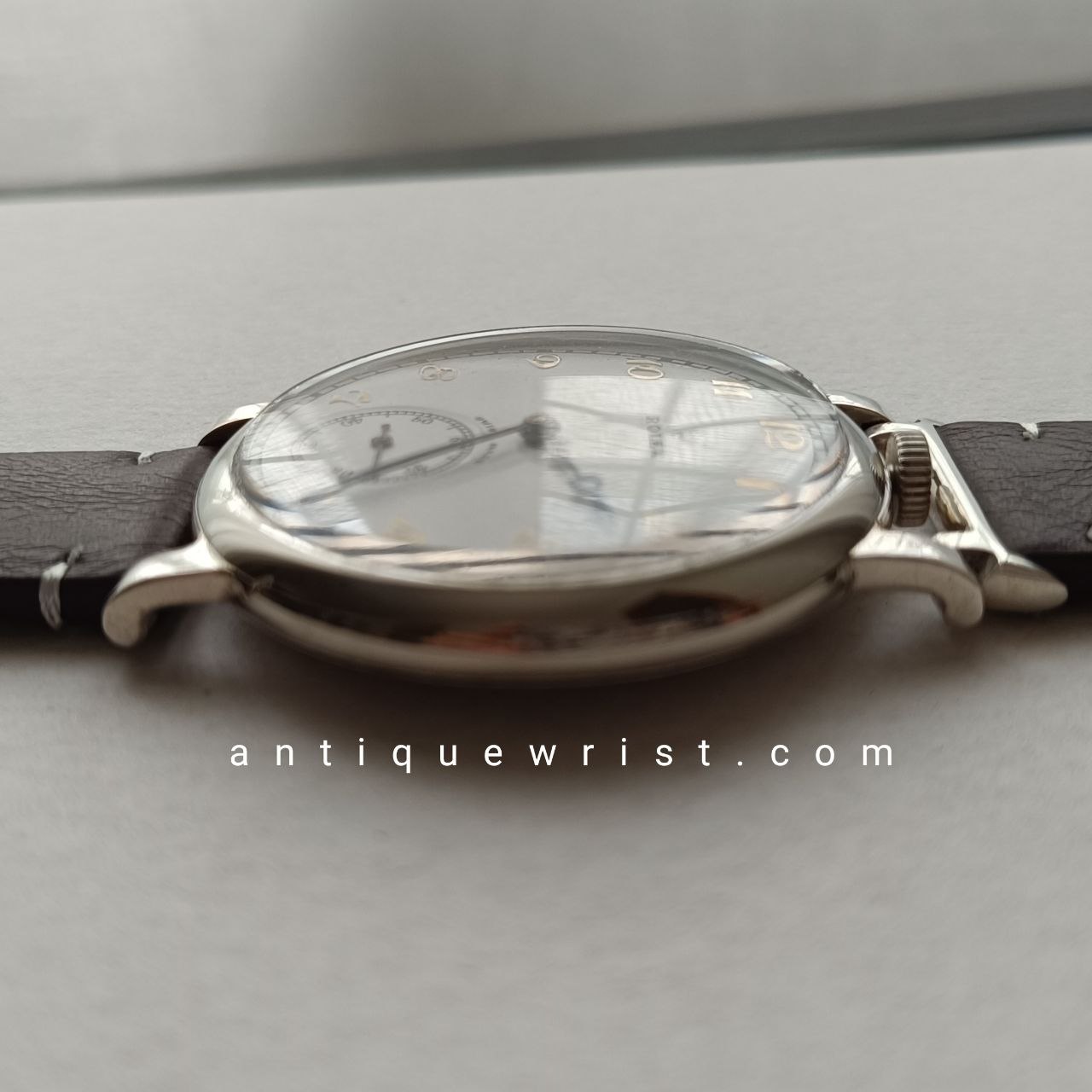 Profile of the 48mm vintage military Rolex showing the polished nickel-chrome case, prominent winding crown, and curved lugs with a 22mm strap width.