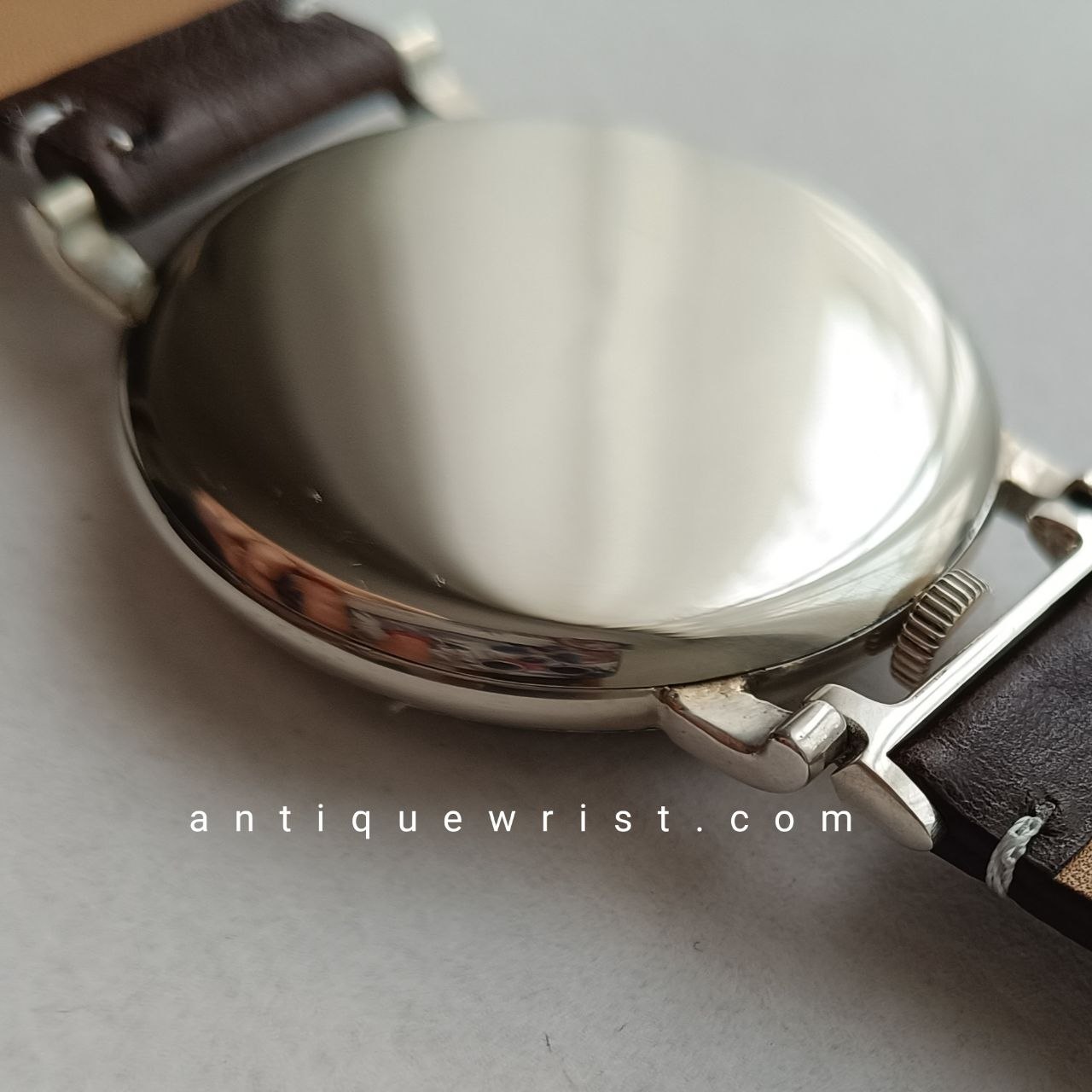 Rear exterior of the vintage Rolex watch caseback, engraved with serial number 440314, made of white nickel-chrome alloy, showing no wear or scratches.