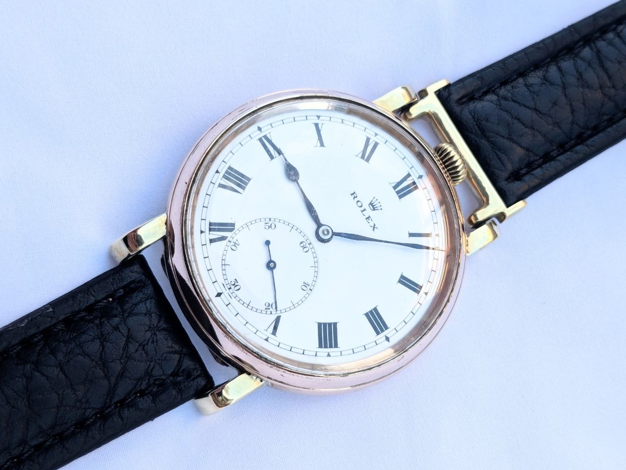 Rolex 9kt rolled gold front view, Dennison Star case 50mm with white dial and Arabic numerals, 1930s