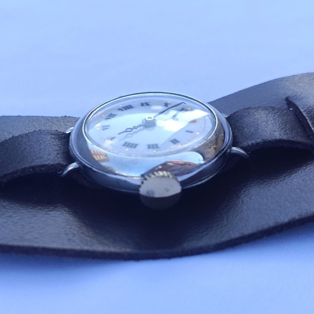 trench rolex side