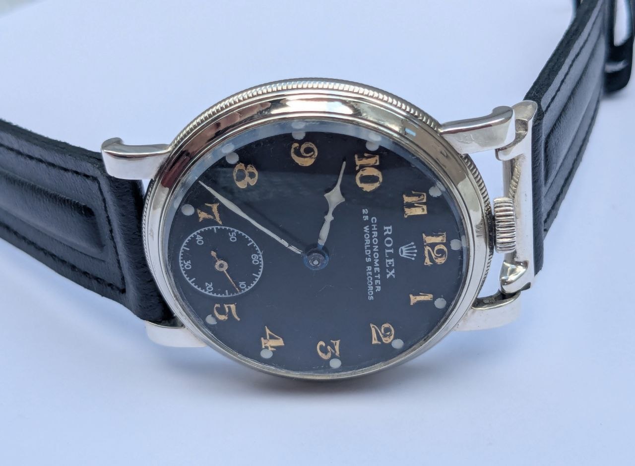 Vintage Rolex Chronometer 25 World's Records front view, black military dial with Arabic numerals, 43mm SAR RWCo Ltd case