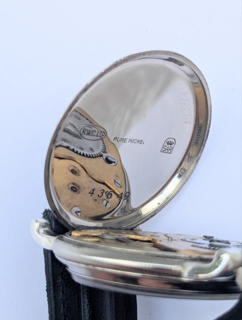 Vintage Rolex hallmarks detail, case back engraving and silver content mark, 25 World's Records watch