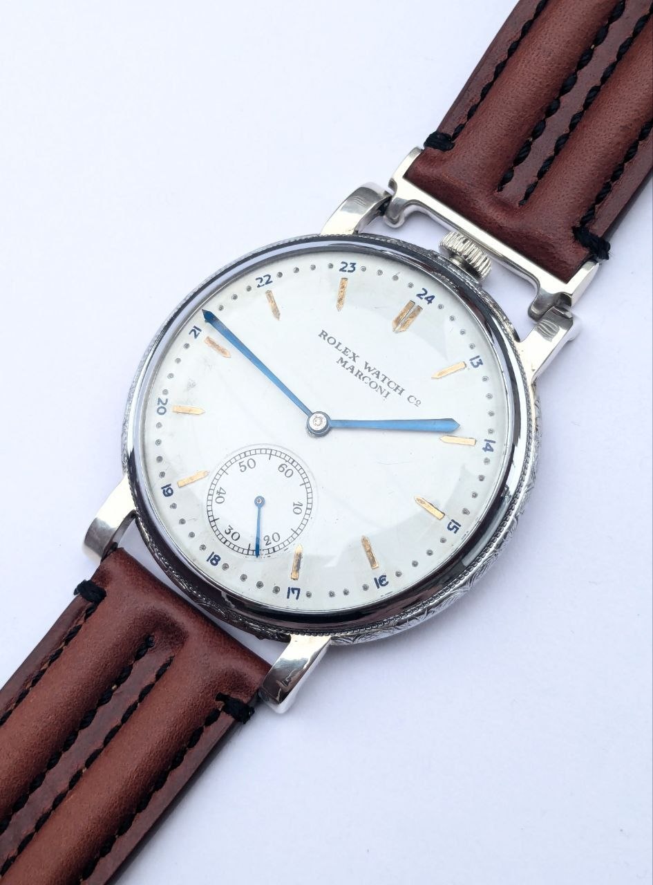Art deco Rolex Marconi front view, guilloche cream dial with Arabic numerals and blue steel hands, 1930s