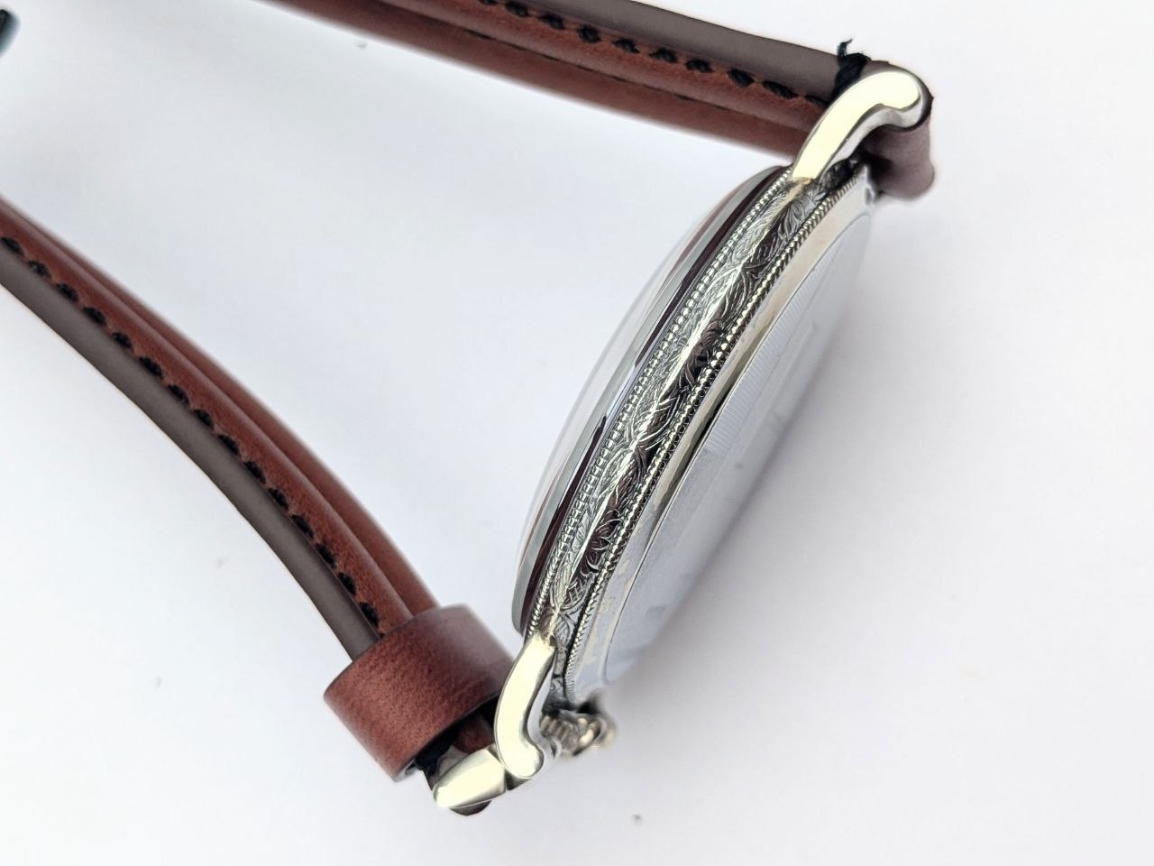 Art deco Rolex Marconi side view, guilloche case profile and lug detail, 1930s solid silver wristwatch