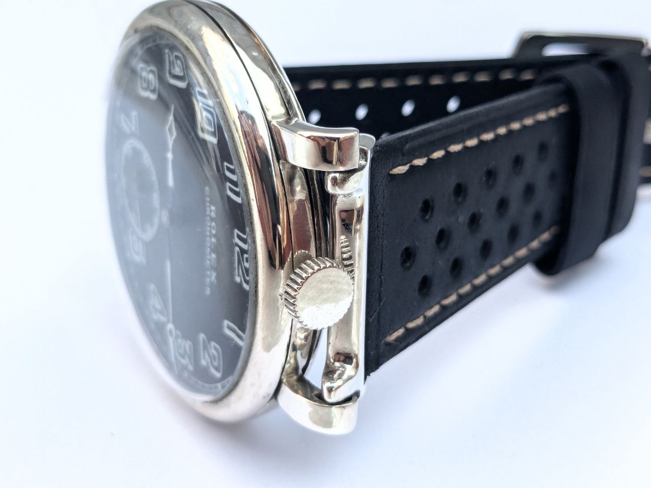 Antique Rolex Marconi chronometer three-quarter view, black dial and steel hands, 47.5mm silver case