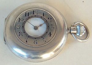 Vintage Omega half-hunter pocket watch before conversion — front view showing guilloche case and inner dial