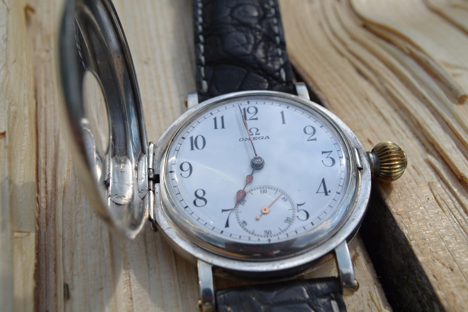Converted Omega pocket watch as wristwatch — dial view with hunter case open on leather strap