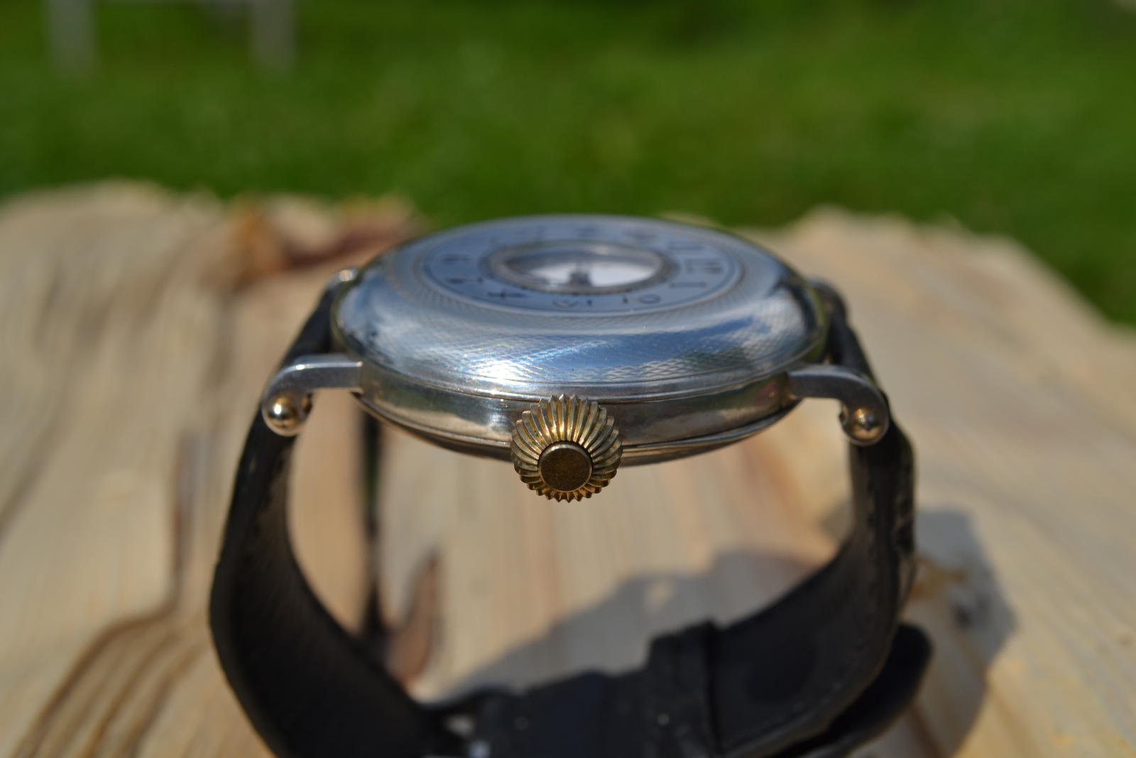 Converted Omega wristwatch — side view showing precision-welded lugs and winding crown placement