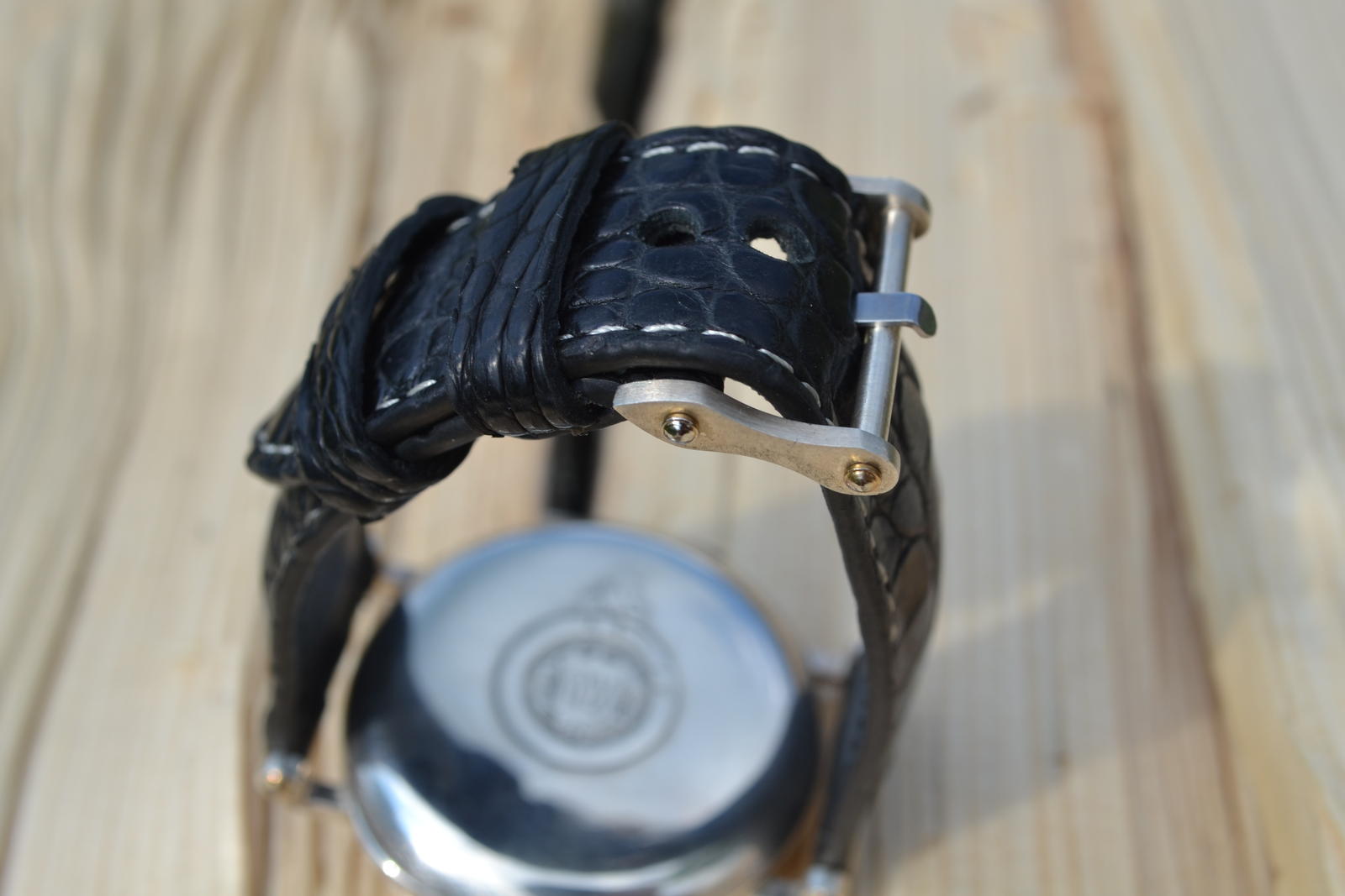 Detail of precision-welded lugs on converted Omega pocket watch wristwatch